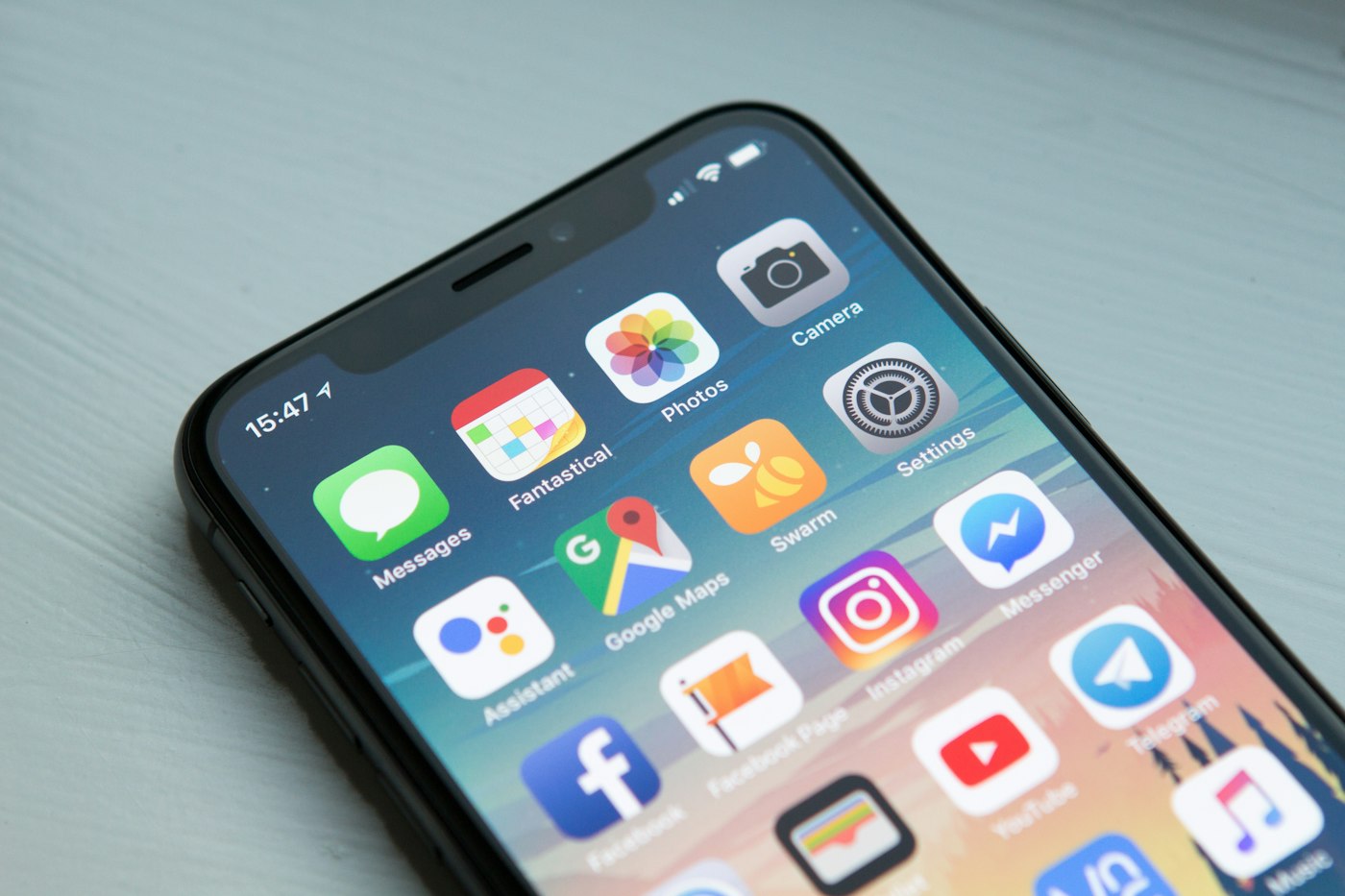 A phone held in a hand, the surface most device products still need